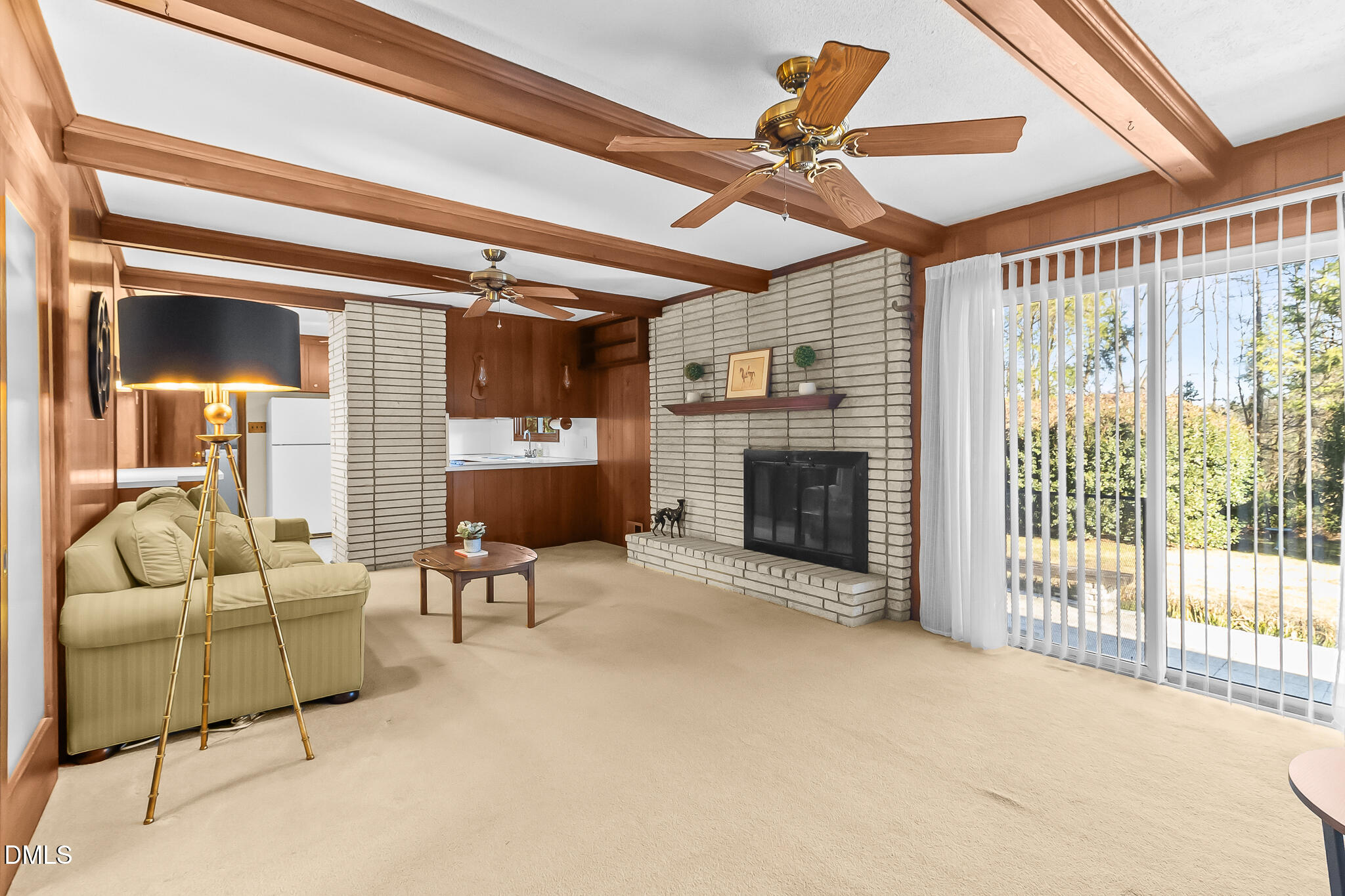 1704 Marshburn Road Wendell, NC 27591 - Photo 7 of 27 a living room with furniture a fireplace and a ceiling fan