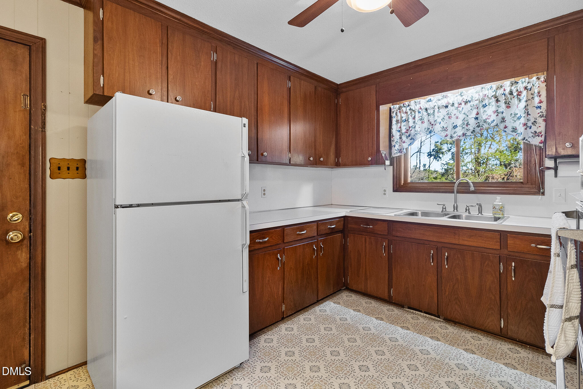 1704 Marshburn Road Wendell, NC 27591 - Photo 9 of 27 a kitchen with stainless steel appliances granite countertop a refrigerator a sink a stove a microwave and wooden cabinets