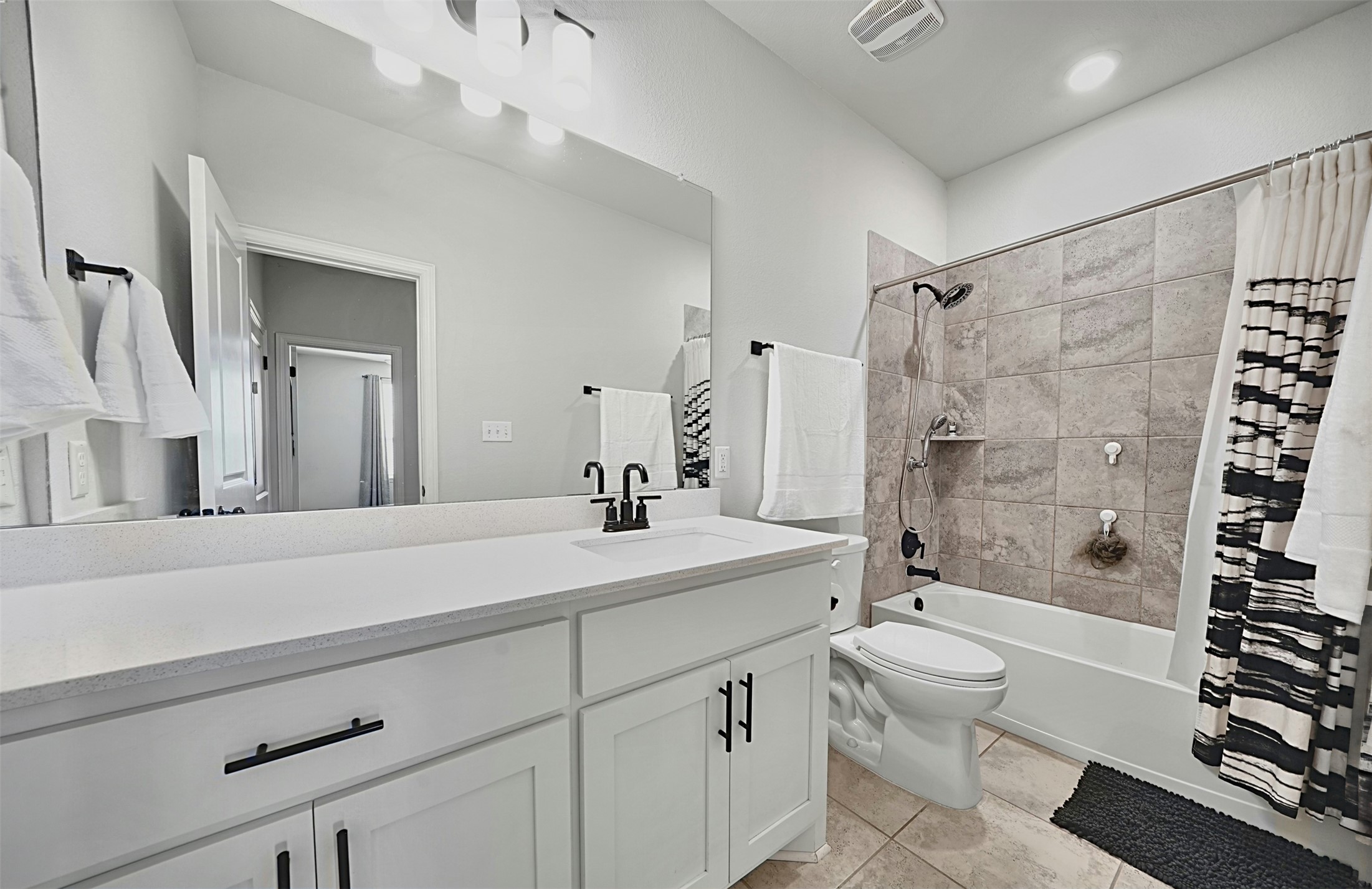 903 Simmental Loop Hutto, TX 78634 - Photo 17 of 26 Second full bathroom with spacious vanity and tub/shower combination