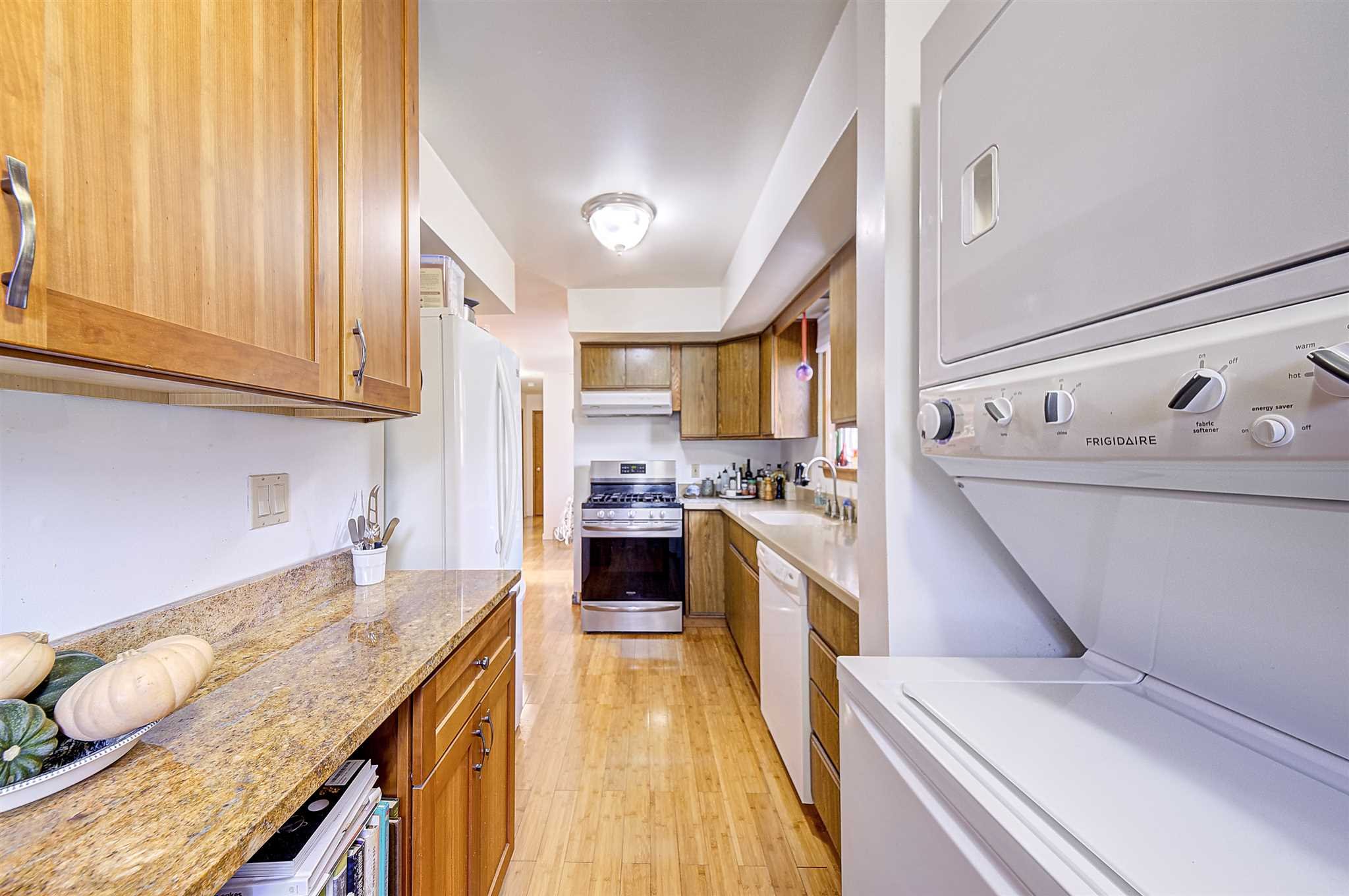 8 Sivers Place Beacon, NY 12508 - Photo 12 of 31 a kitchen with a sink a stove and cabinets