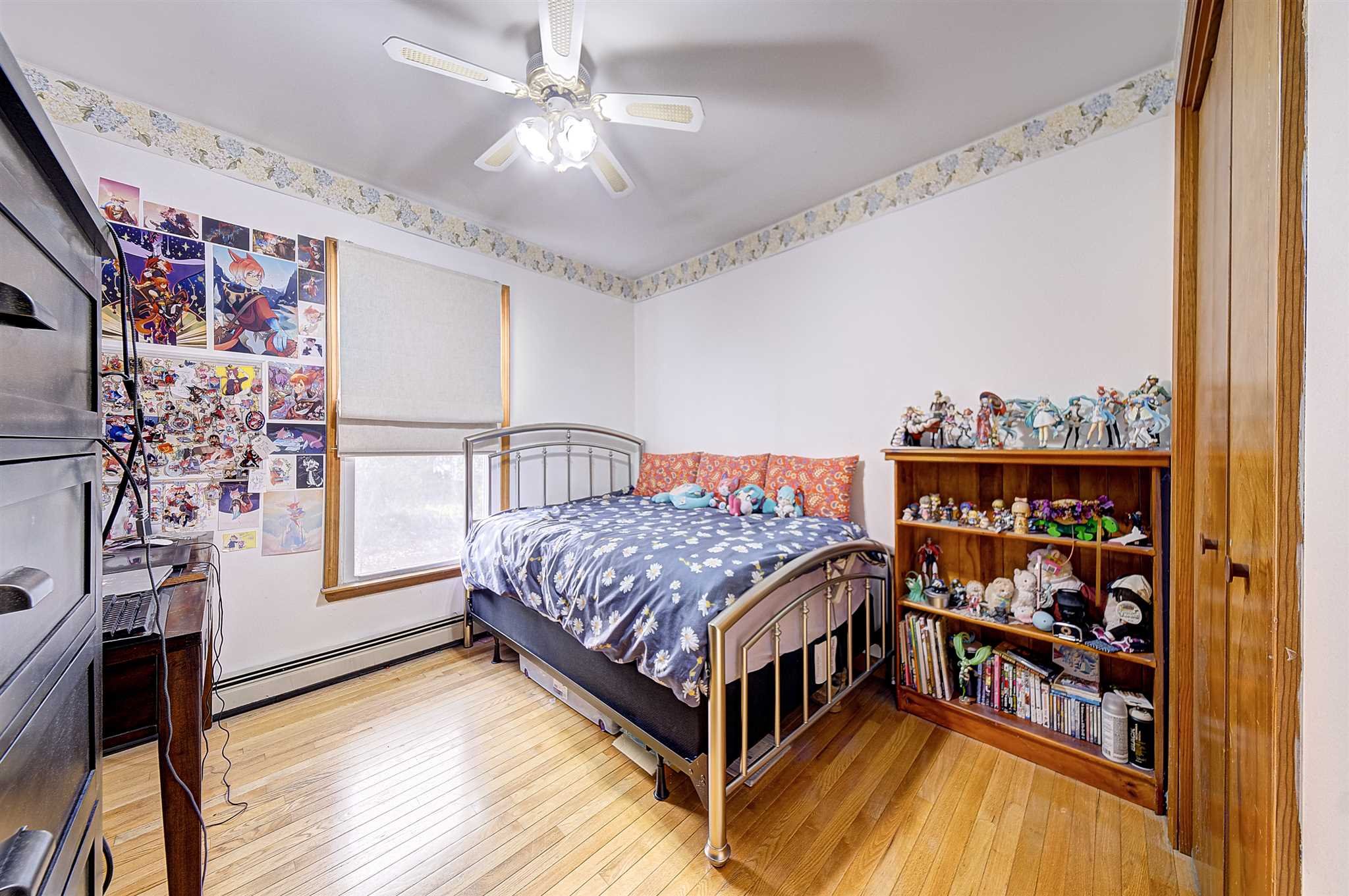 8 Sivers Place Beacon, NY 12508 - Photo 16 of 31 a bedroom with a bed and a chandelier