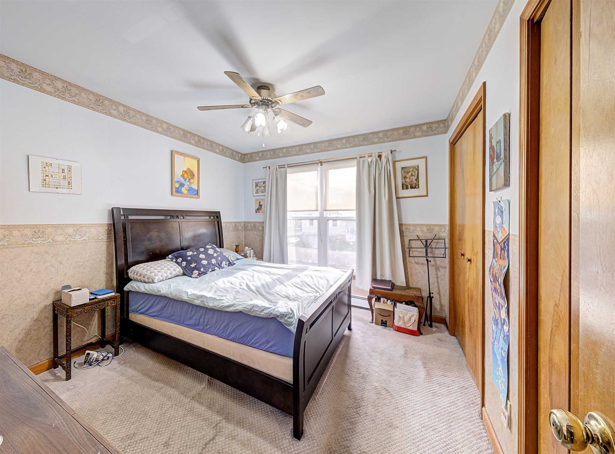 8 Sivers Place Beacon, NY 12508 - Photo 19 of 31 a bedroom with a bed lamp and a large window