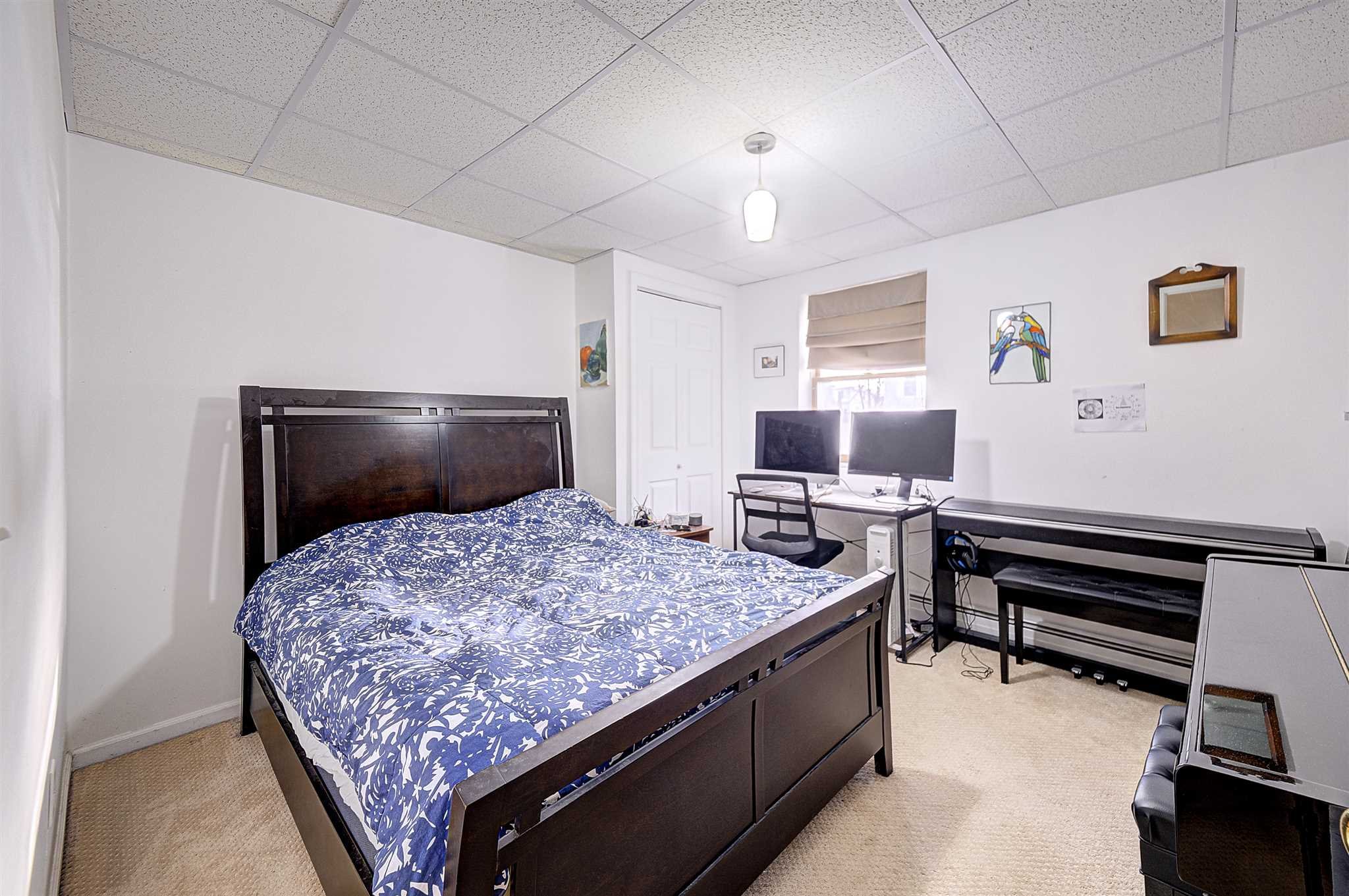 8 Sivers Place Beacon, NY 12508 - Photo 23 of 31 a bedroom with a bed and a television