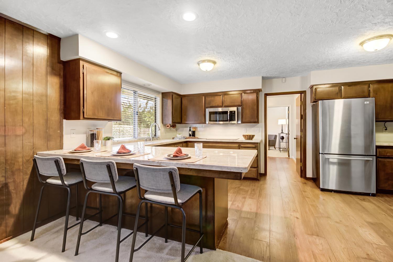 2964 Marco Way Carmichael, CA 95608 - Photo 13 of 49 a kitchen that has a table chairs refrigerator and microwave