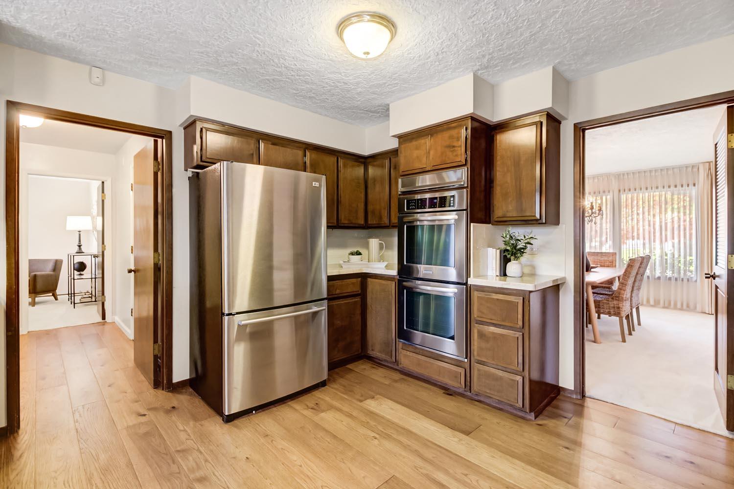 2964 Marco Way Carmichael, CA 95608 - Photo 17 of 49 a kitchen with stainless steel appliances granite countertop a refrigerator and a stove top oven