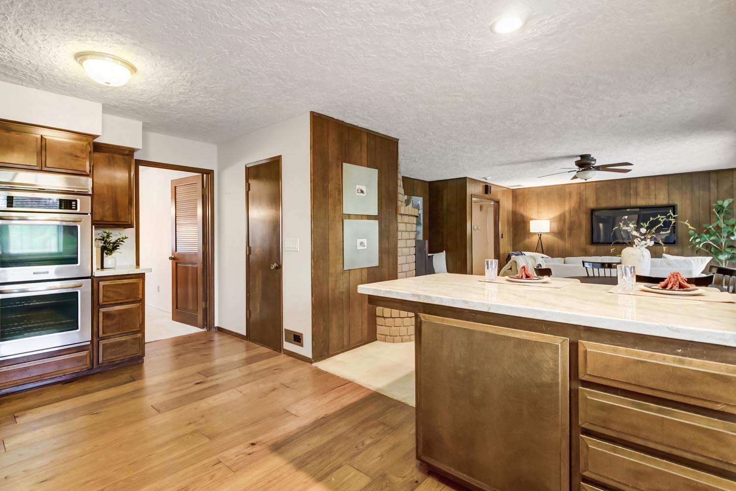 2964 Marco Way Carmichael, CA 95608 - Photo 18 of 49 a kitchen with stainless steel appliances granite countertop a refrigerator a stove and a sink with wooden floor