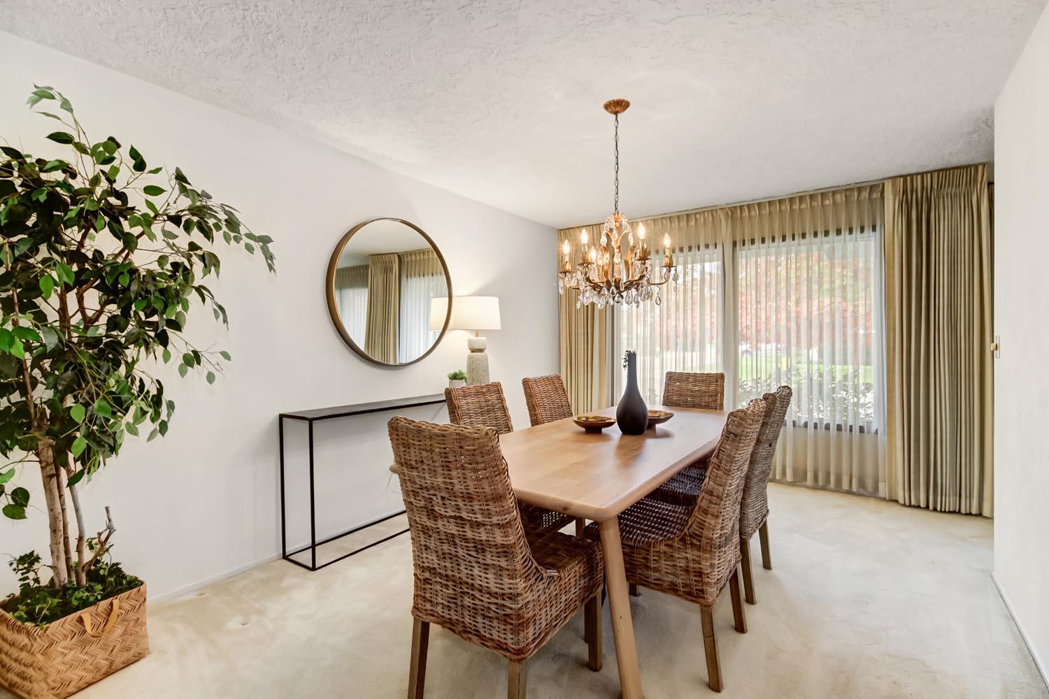 2964 Marco Way Carmichael, CA 95608 - Photo 22 of 49 a dining room with furniture a chandelier and a rug