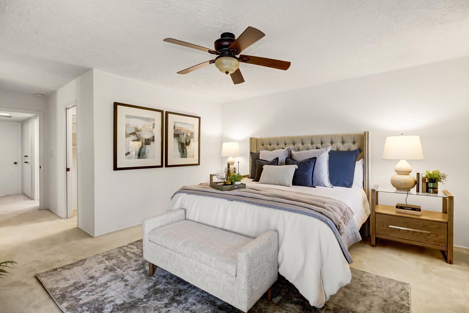 2964 Marco Way Carmichael, CA 95608 - Photo 26 of 49 a spacious bedroom with a bed and a ceiling fan