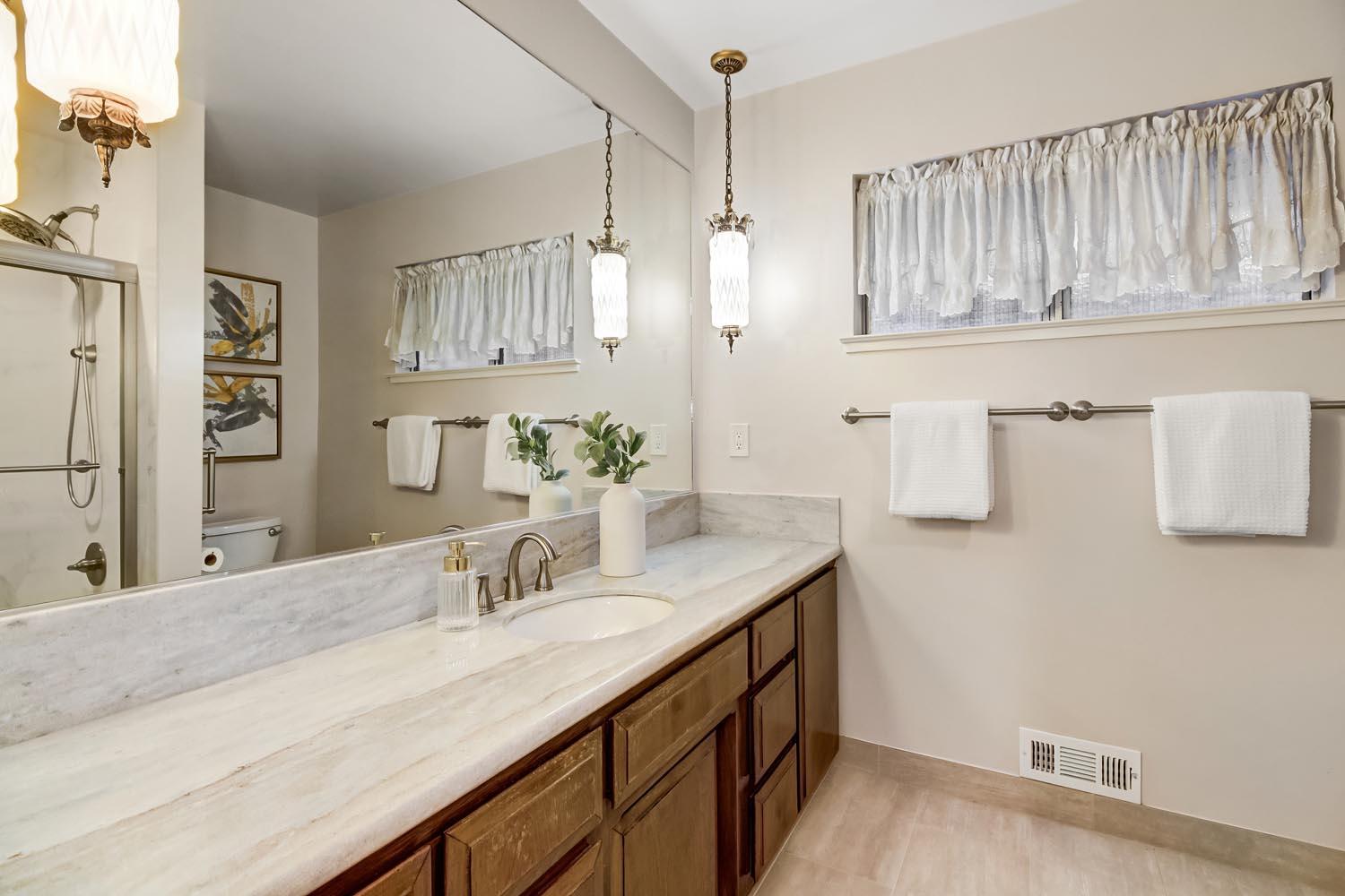 2964 Marco Way Carmichael, CA 95608 - Photo 36 of 49 a bathroom with a sink and a mirror