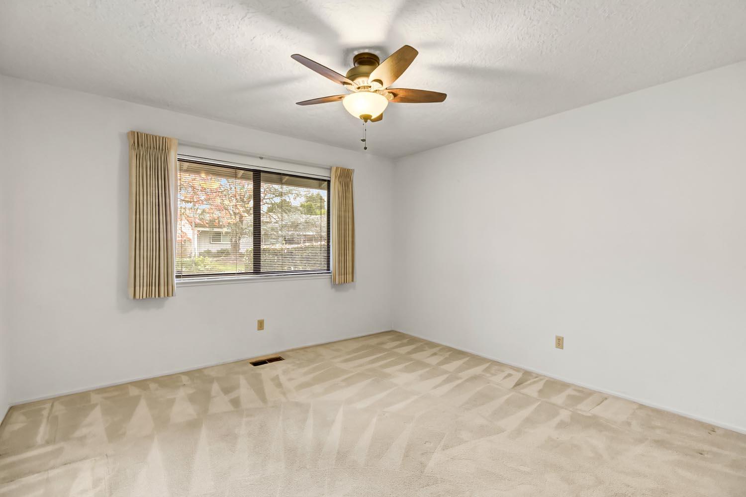 2964 Marco Way Carmichael, CA 95608 - Photo 38 of 49 an empty room with ceiling fan and window