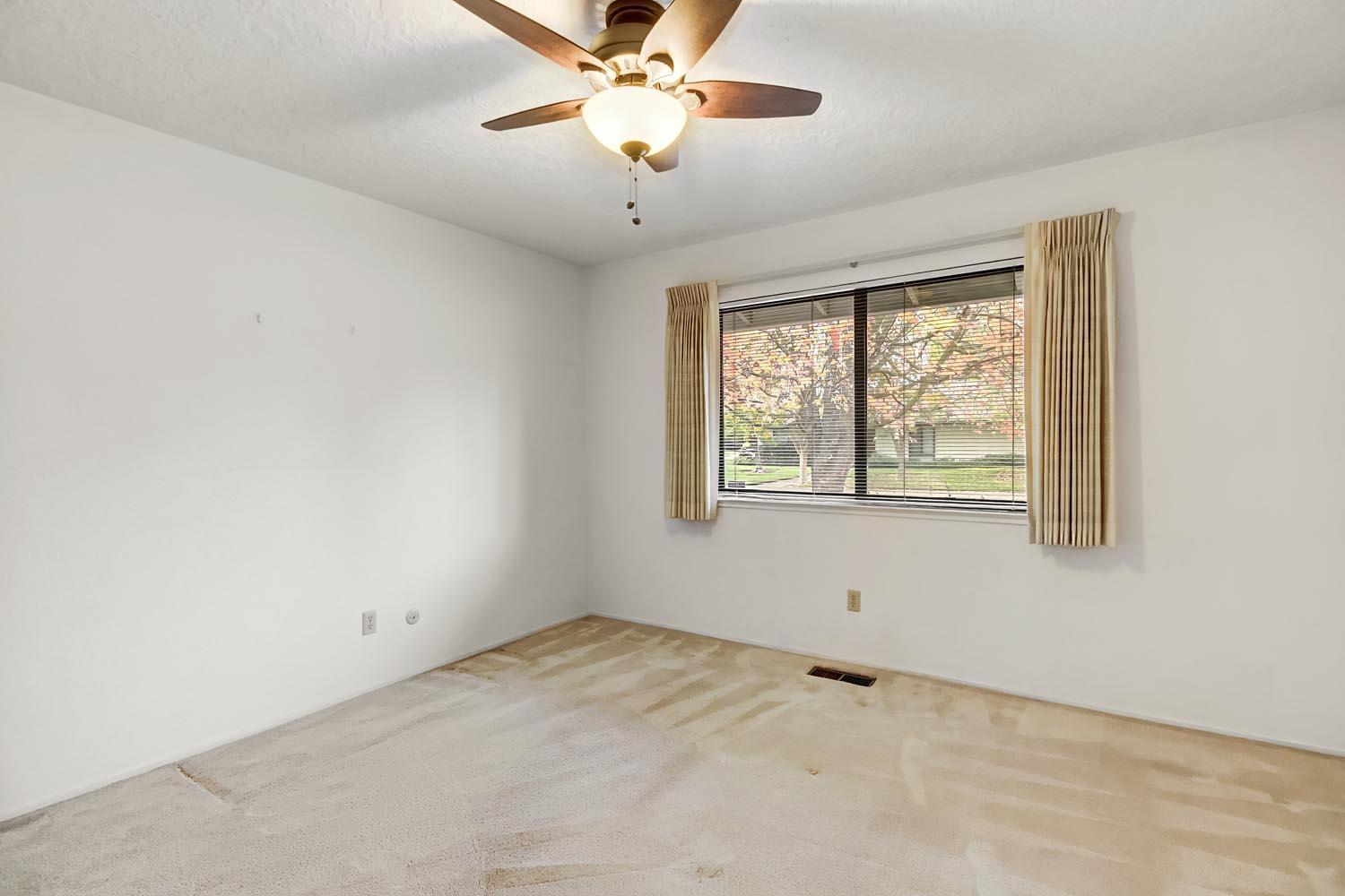 2964 Marco Way Carmichael, CA 95608 - Photo 39 of 49 an empty room with a window and a fan