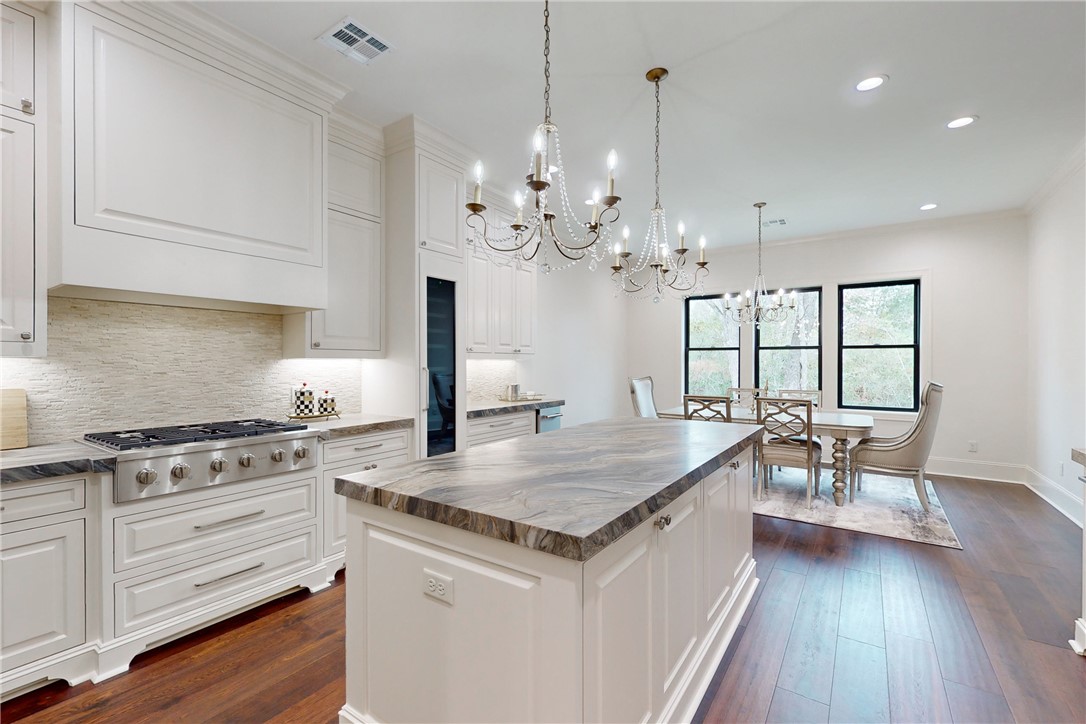 3317 Legacy Court Bryan, TX 77802 - Photo 4 of 28 a kitchen that has a lot of cabinets in it