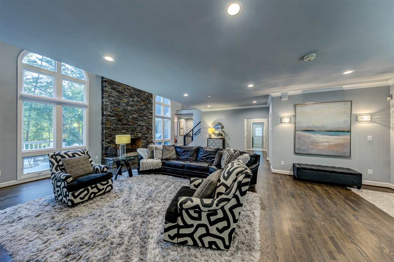 648 Pendleton Lake Road Raleigh, NC 27614 - Photo 5 of 30 The Family Room is centered around the spectacular two story stacked stone fireplace. Gleaming Hardwood Floors! Family Room