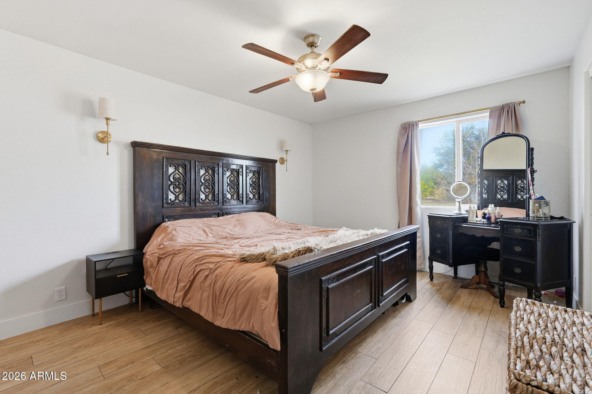 2858 East Redfield Road Gilbert, AZ 85234 - Photo 31 of 60 a bedroom with a bed and a dresser next to a window
