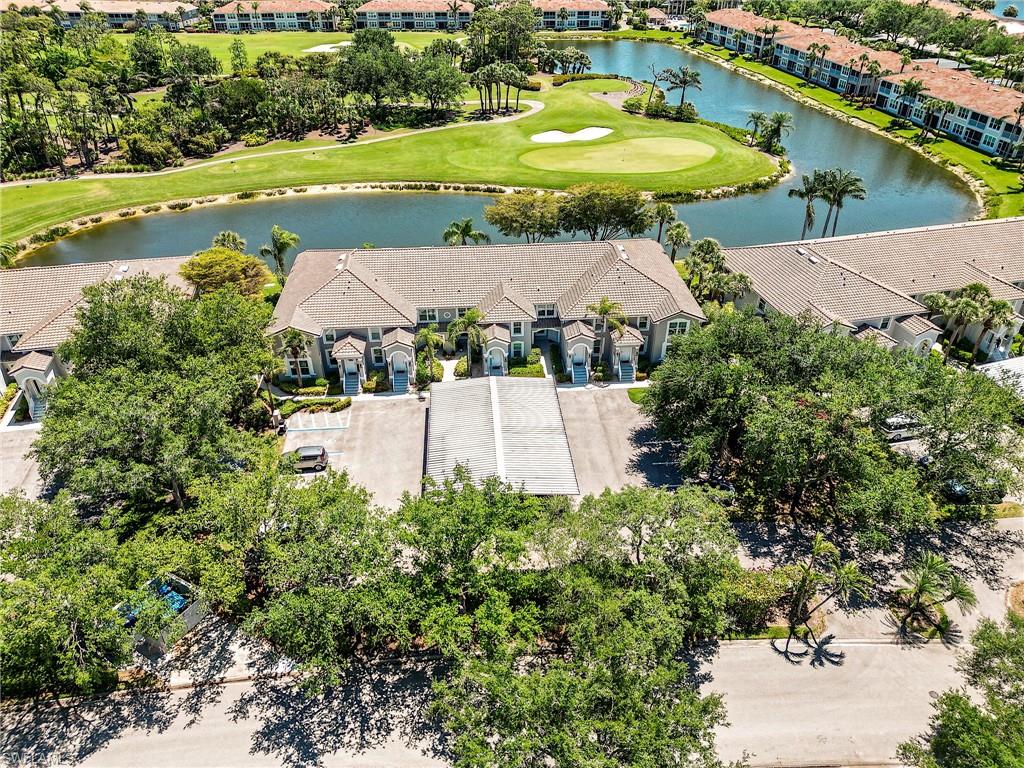 an aerial view of residential houses with outdoor space and swimming pool