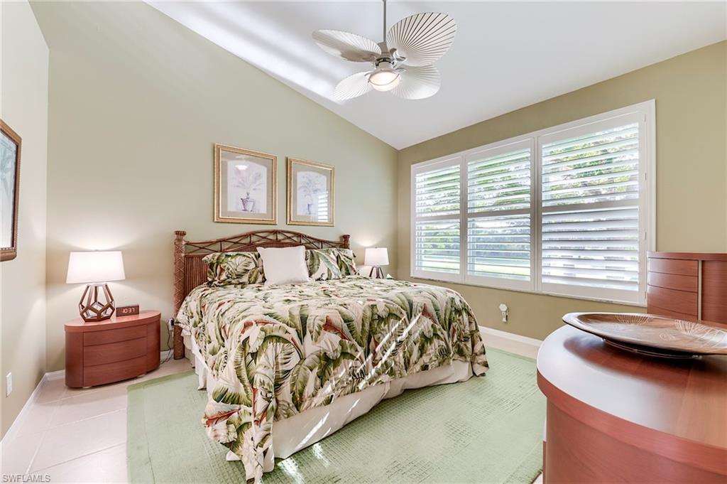 9241 Spring Run Boulevard, Unit 2202 Estero, FL 34135 - Photo 12 of 33 a bedroom with a bed and a couch