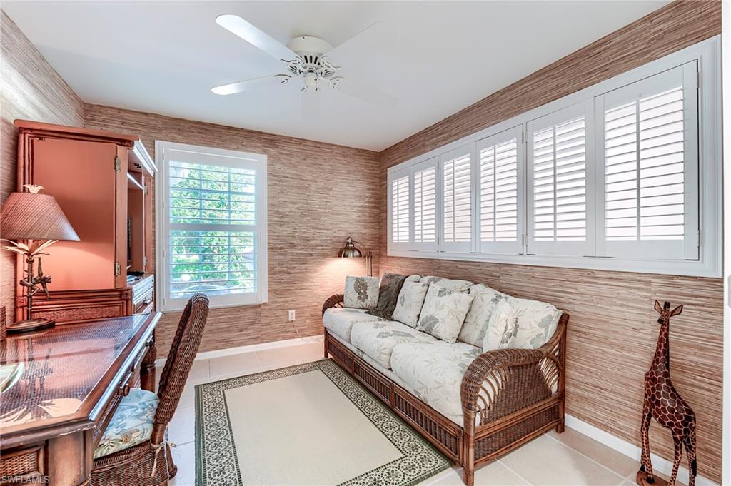 9241 Spring Run Boulevard, Unit 2202 Estero, FL 34135 - Photo 19 of 33 a living room with furniture and a large window