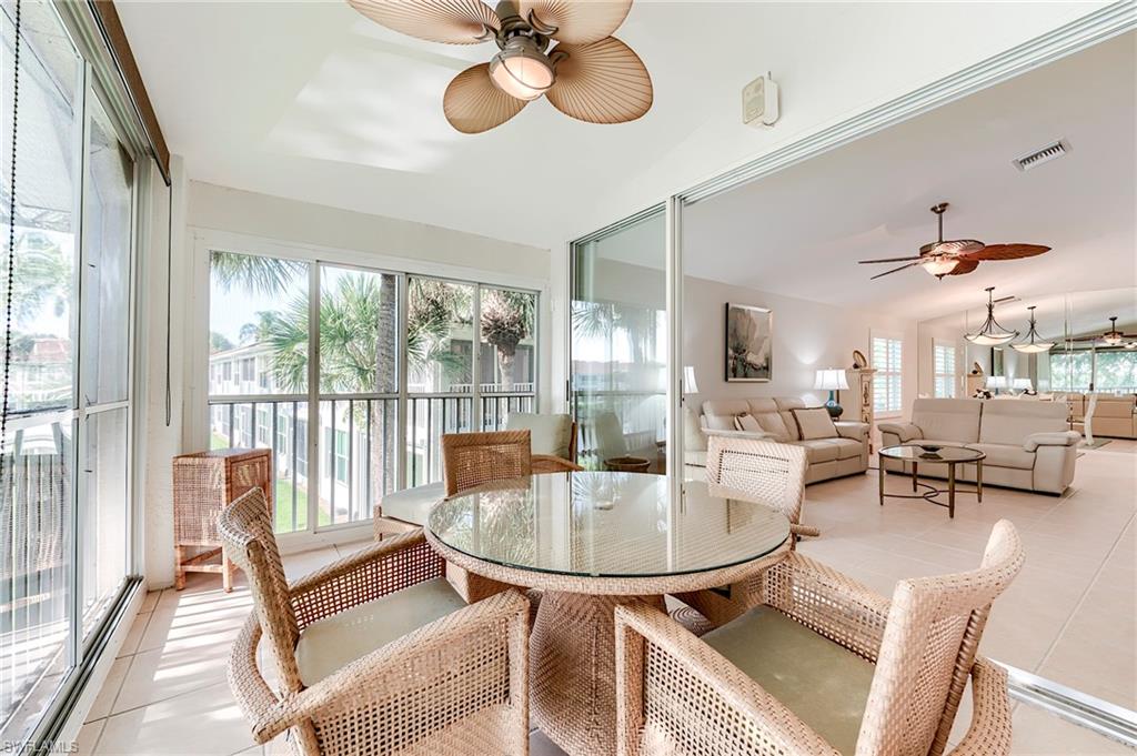 9241 Spring Run Boulevard, Unit 2202 Estero, FL 34135 - Photo 20 of 33 a living room with furniture and a large window