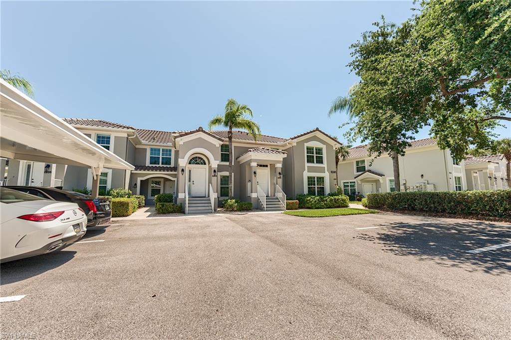 9241 Spring Run Boulevard, Unit 2202 Estero, FL 34135 - Photo 24 of 33 a front view of a house with a garden