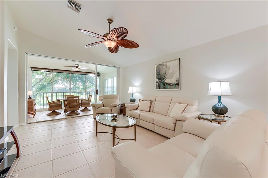 9241 Spring Run Boulevard, Unit 2202 Estero, FL 34135 - Photo 7 of 33 a living room with furniture and a large window