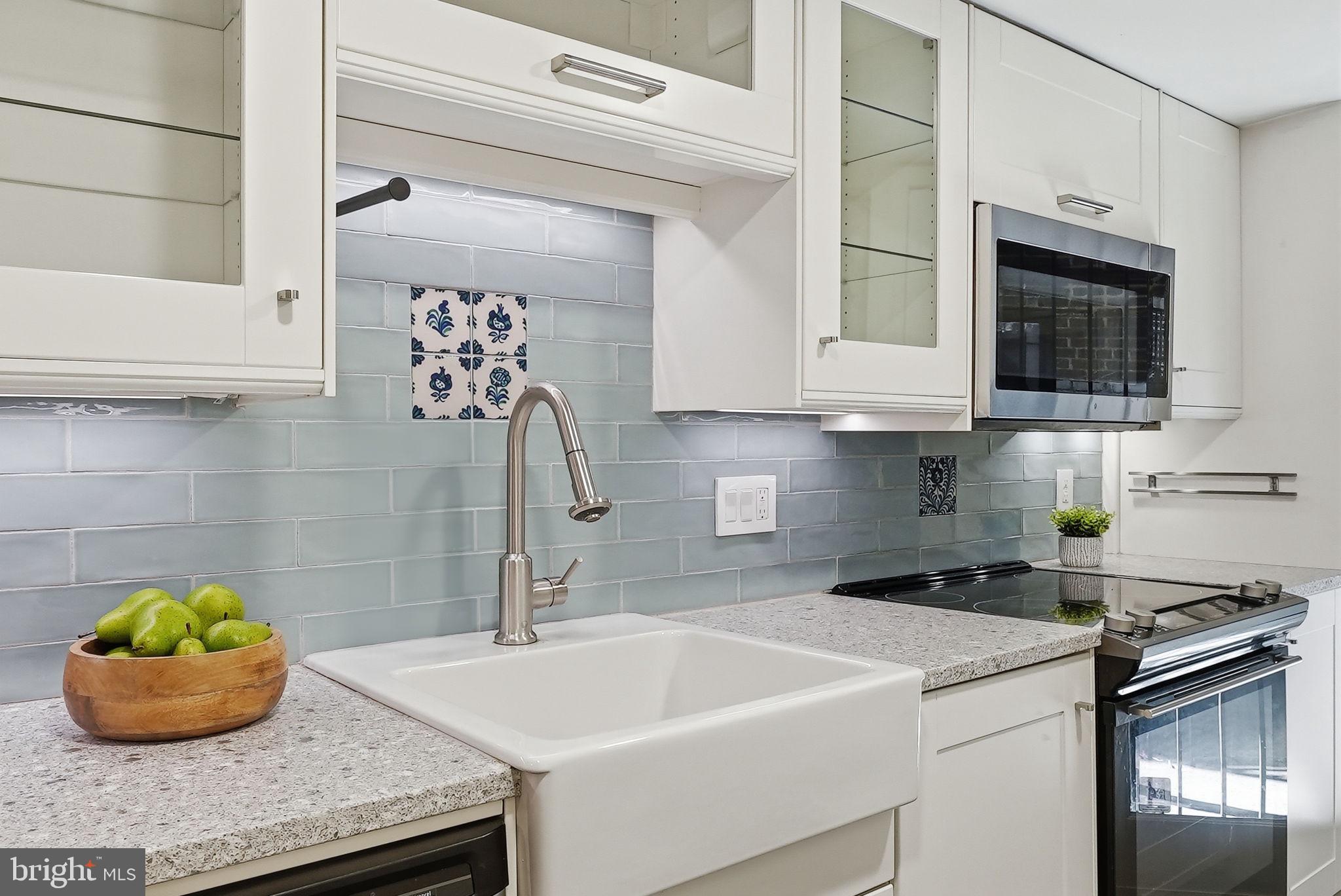 1200 East Capitol Street Northeast, Unit 1 Washington, DC 20002 - Photo 15 of 31 a kitchen with a sink and a stove