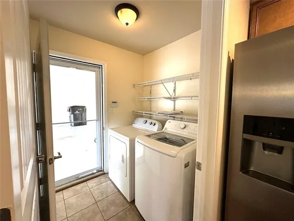 a room that has a refrigerator and a stove