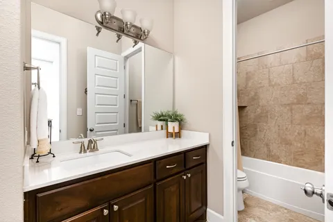 a view of a patio with chairs under an umbrella