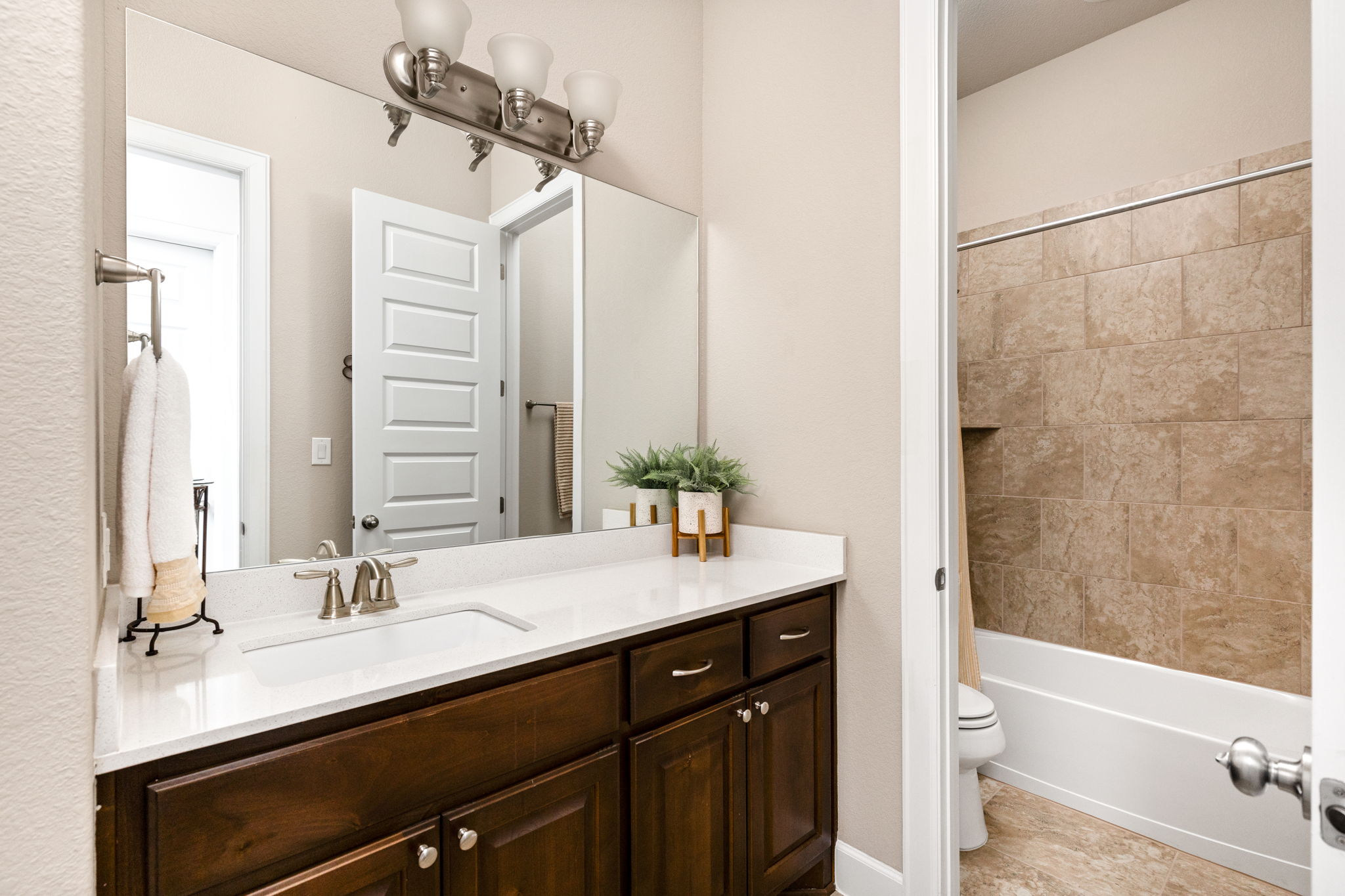144 Cats Eye Cove Dripping Springs, TX 78620 - Photo 21 of 31 The guest bathroom features a clean, bright layout with timeless finishes.