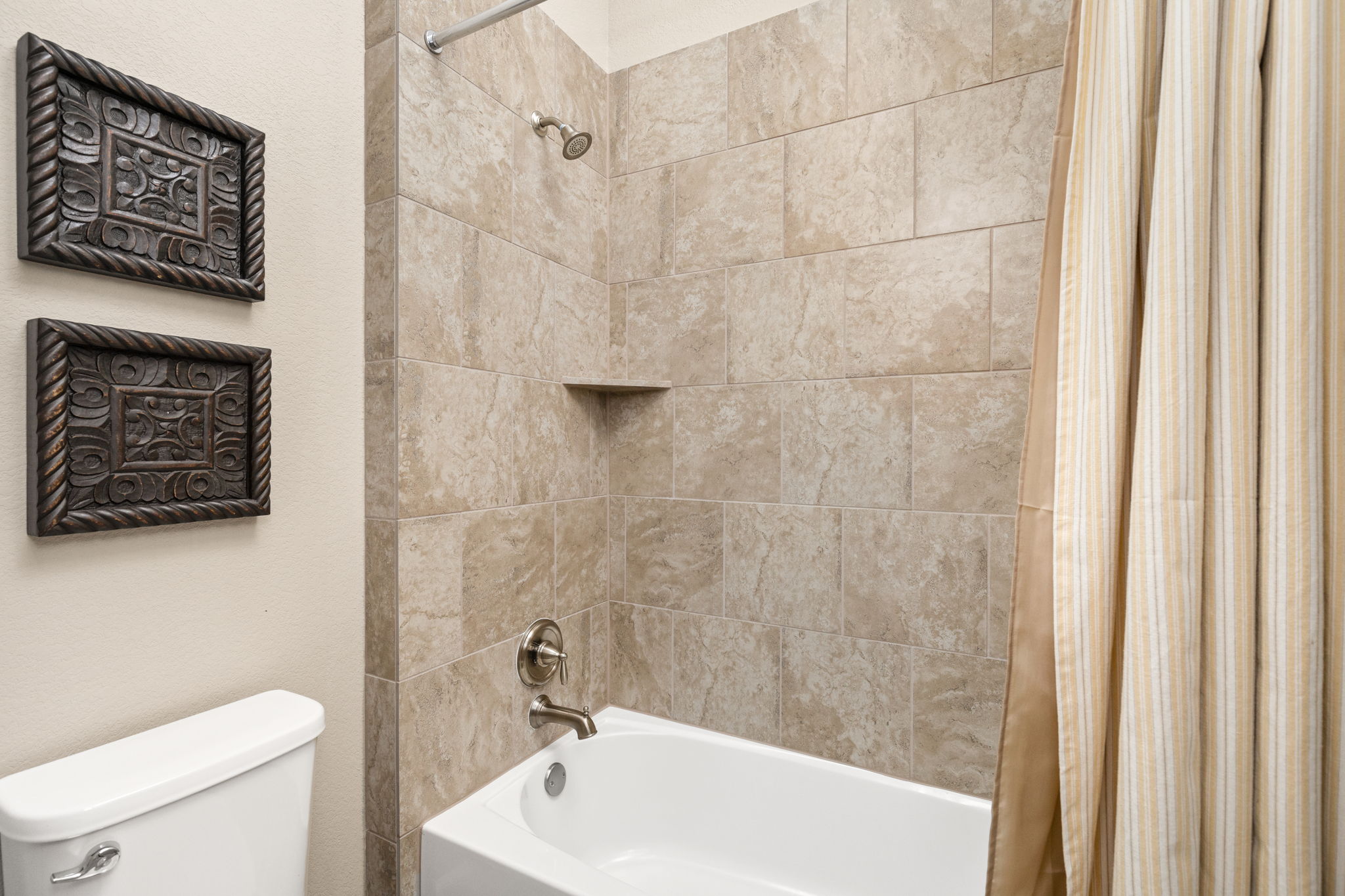 144 Cats Eye Cove Dripping Springs, TX 78620 - Photo 22 of 31 The tub and shower combination offers versatility for guests and household use.