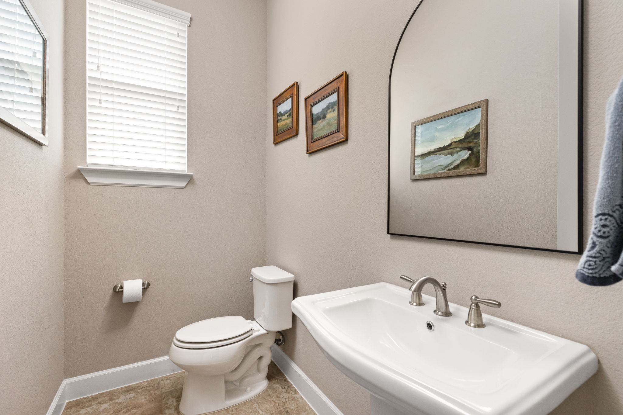 144 Cats Eye Cove Dripping Springs, TX 78620 - Photo 23 of 31 The half bathroom provides a convenient option for guests and everyday use.