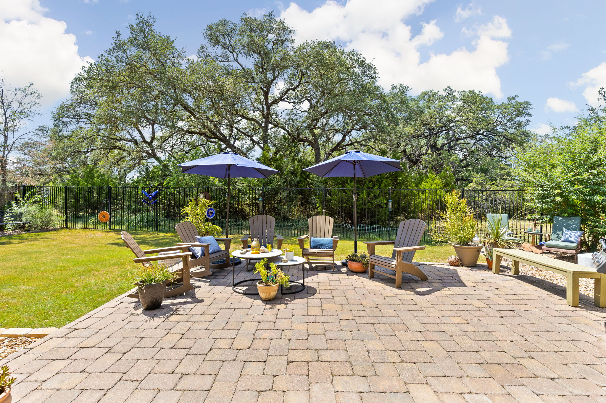 144 Cats Eye Cove Dripping Springs, TX 78620 - Photo 25 of 31 The expansive patio is ideal for outdoor dining and entertaining.