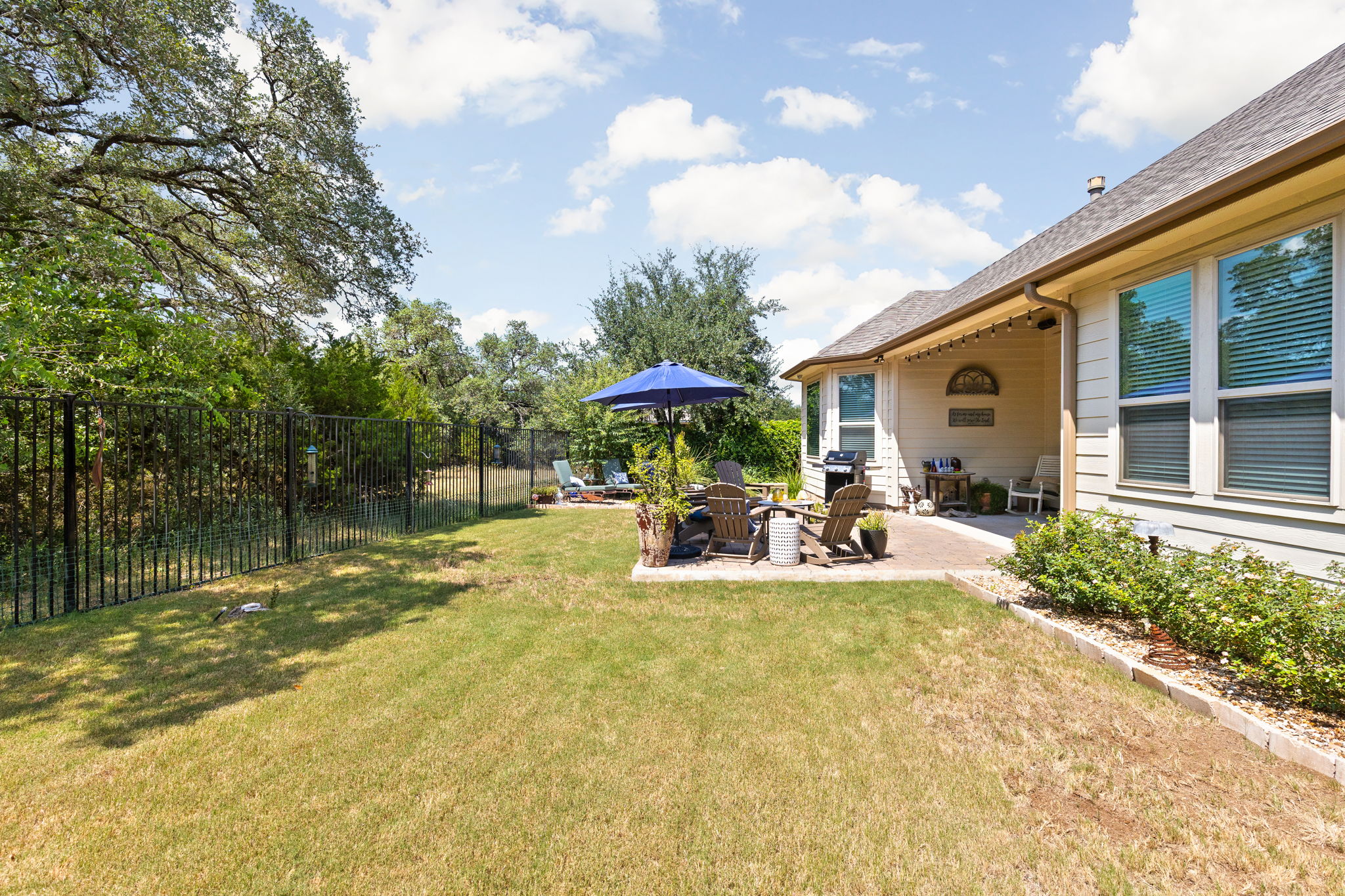 144 Cats Eye Cove Dripping Springs, TX 78620 - Photo 28 of 31 The greenbelt backdrop provides privacy and scenic natural views.