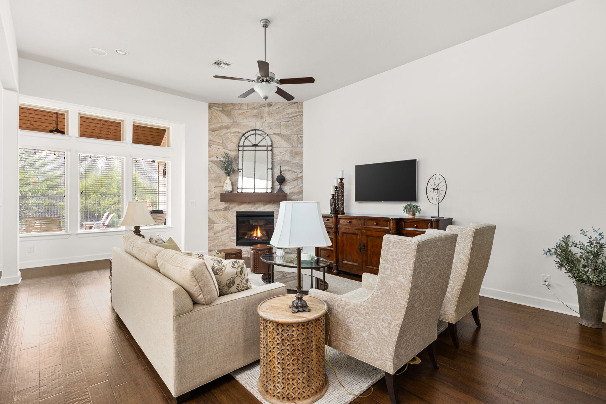 144 Cats Eye Cove Dripping Springs, TX 78620 - Photo 3 of 31 Oversized windows frame serene backyard and greenbelt views.