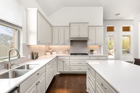 a view of a livingroom with furniture and a window