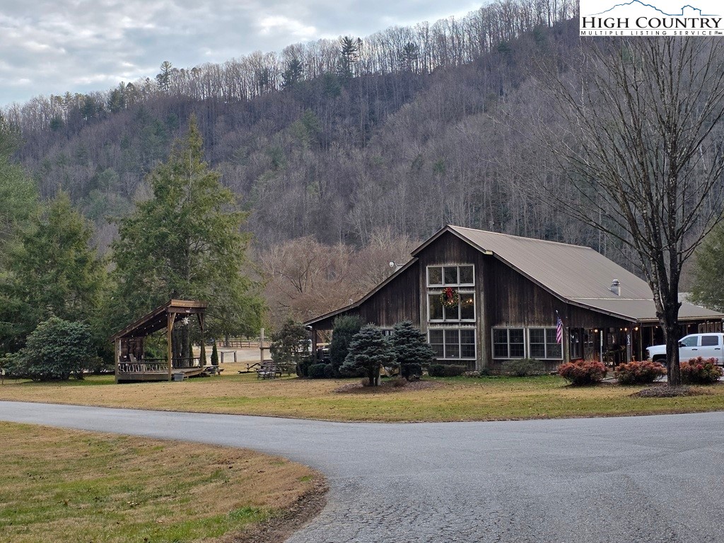 Lot 105 Holleridge Road Ferguson, NC 28624 - Photo 3 of 42 a view of a house with pool and a yard