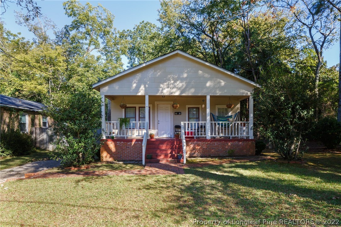 117 Ruth Street Fayetteville, NC 28305 - Photo 1 of 27 a front view of a house with garden