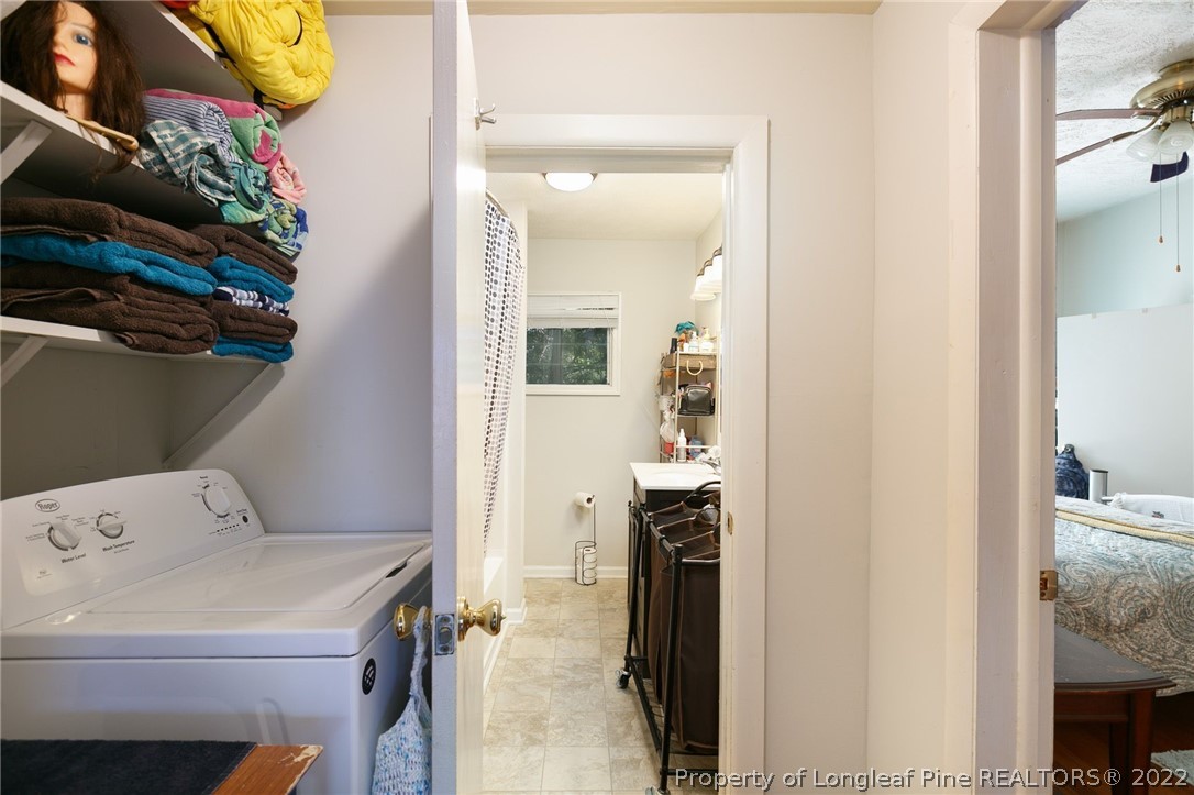 117 Ruth Street Fayetteville, NC 28305 - Photo 24 of 27 a utility room with dryer and washer