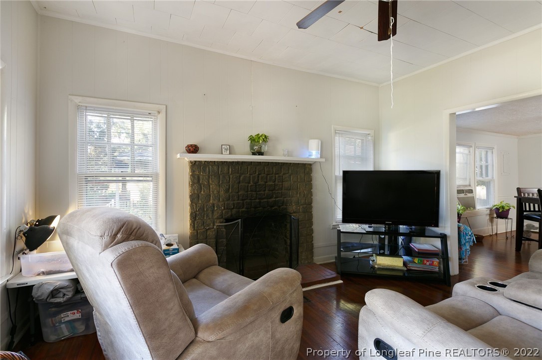 117 Ruth Street Fayetteville, NC 28305 - Photo 5 of 27 a living room with furniture and a flat screen tv
