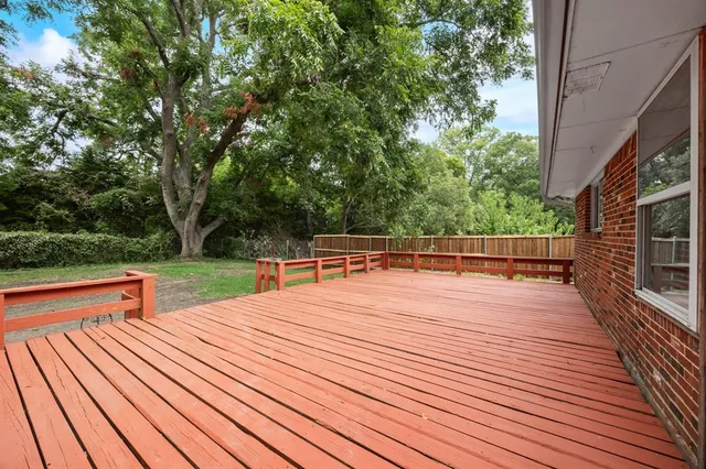 a backyard of a house with barbeque oven