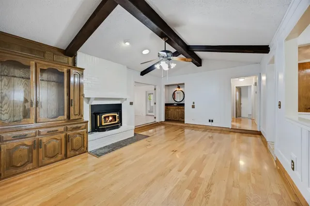 a view of a kitchen with a sink and a fireplace