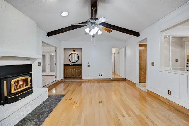 a view of an empty room and fire place