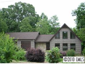 1239 Micol Road Newton, NC 28658 - Photo 1 of 8 a front view of a house with garden