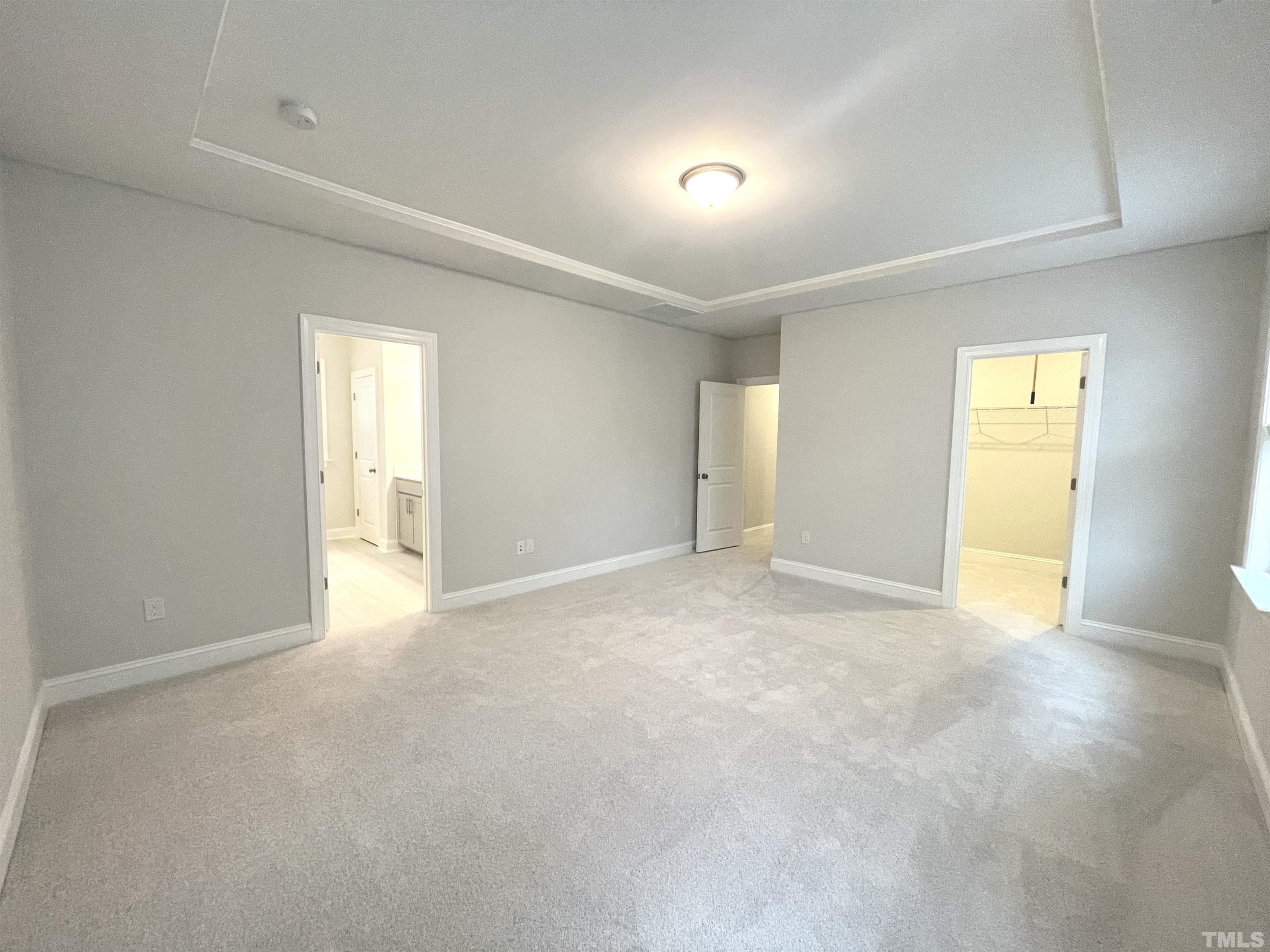 207 Edge Of Auburn Boulevard Raleigh, NC 27610 - Photo 11 of 22 a view of an empty room with a window