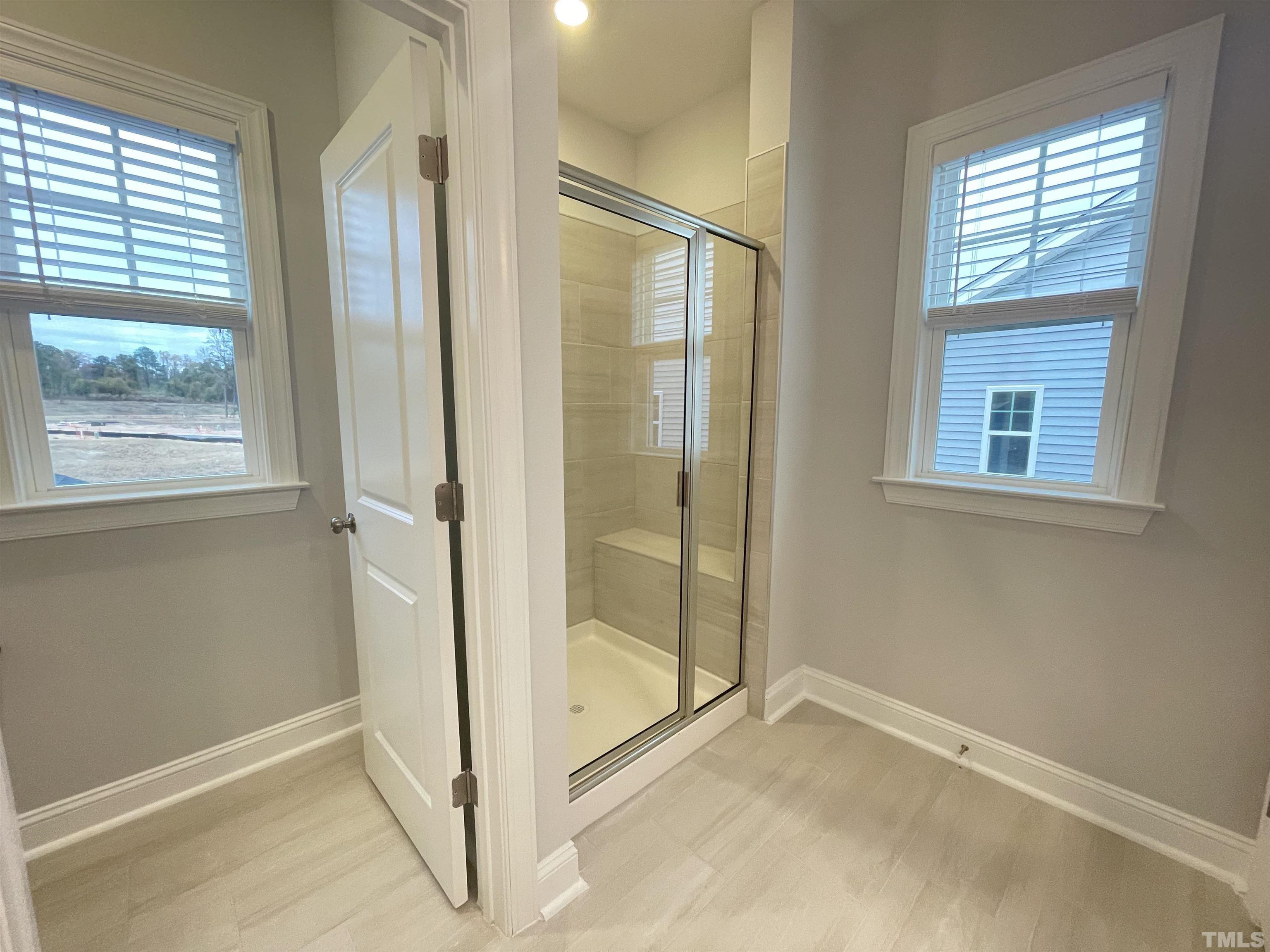 207 Edge Of Auburn Boulevard Raleigh, NC 27610 - Photo 12 of 22 an empty room with windows