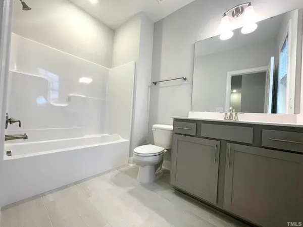 a bathroom with a toilet a sink and a bathtub