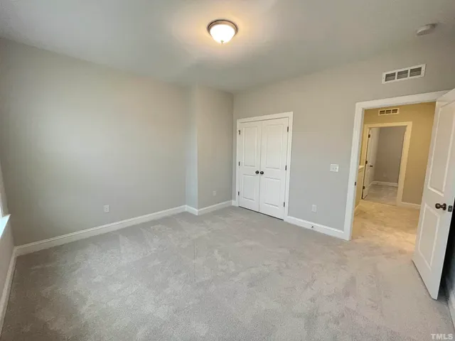 an empty room with a bathroom