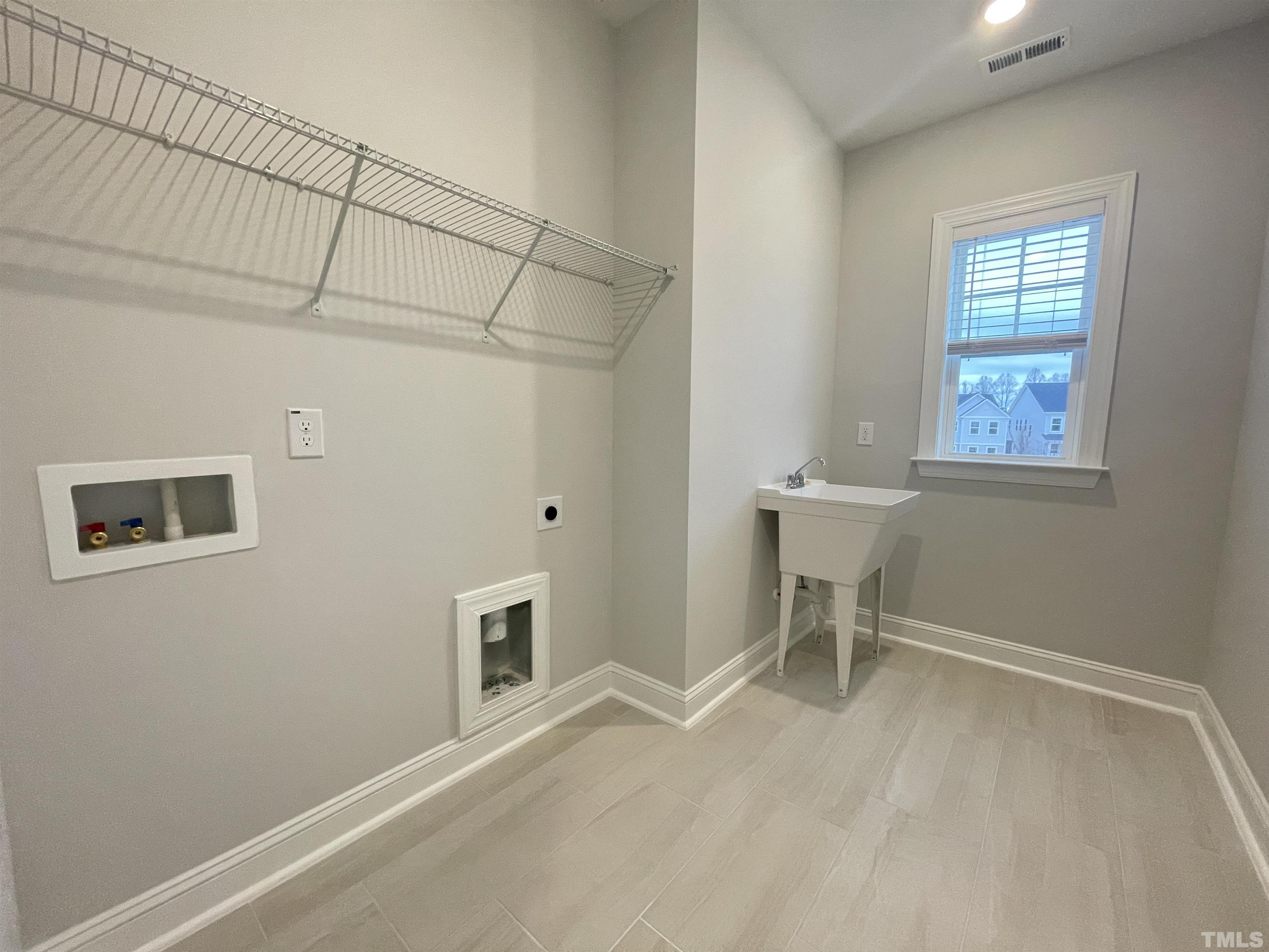 207 Edge Of Auburn Boulevard Raleigh, NC 27610 - Photo 20 of 22 a view of an empty room with a window