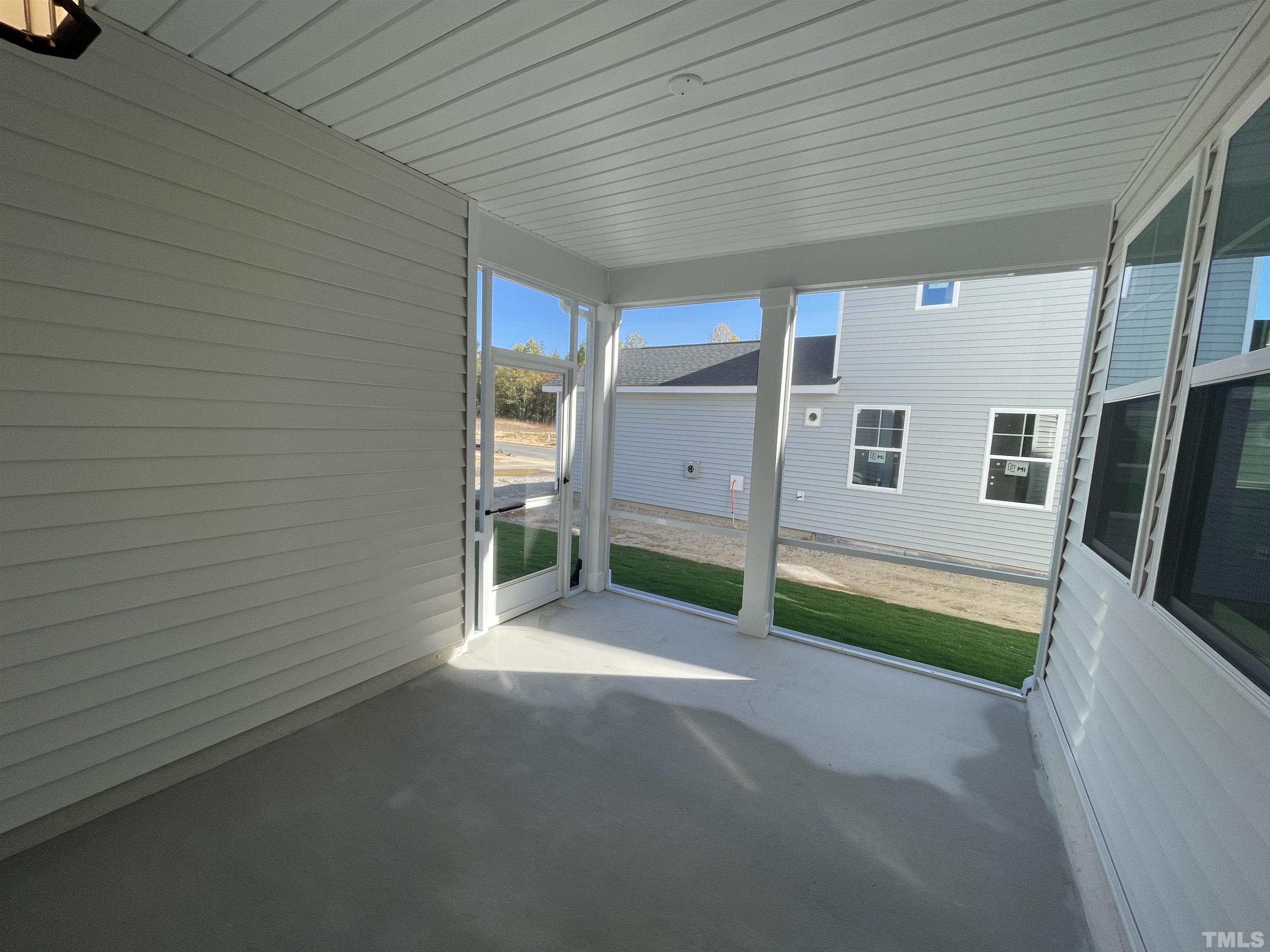 207 Edge Of Auburn Boulevard Raleigh, NC 27610 - Photo 21 of 22 a view of a patio with table and chairs