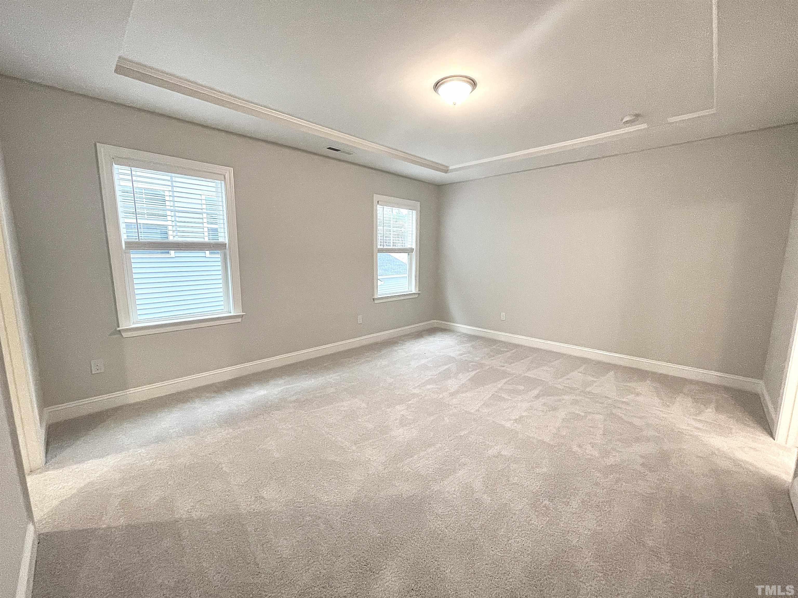 207 Edge Of Auburn Boulevard Raleigh, NC 27610 - Photo 10 of 22 an empty room with windows