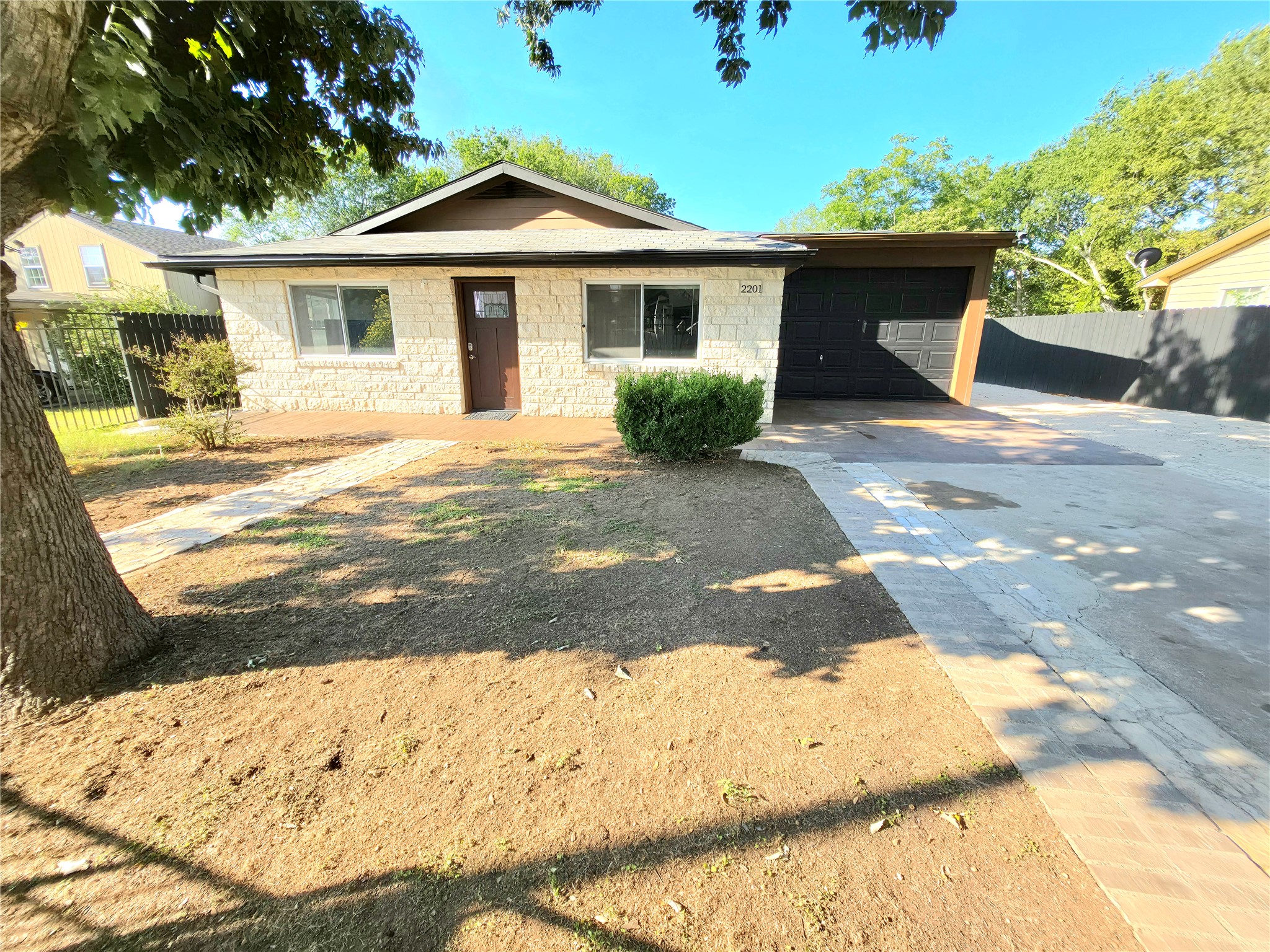 2201 Teri Road Austin, TX 78744 - Photo 25 of 40 Mid-century style meets classic stone siding in this charming single-story residence with an attached garage.